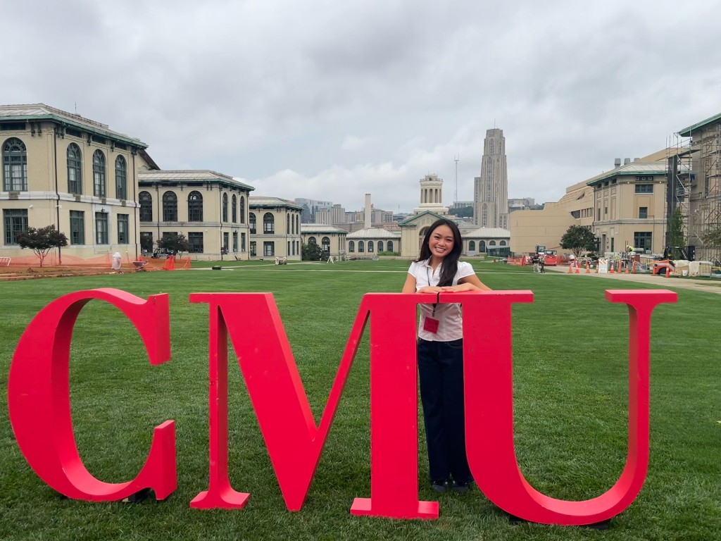 Quynh Van at the CMU sign on campus